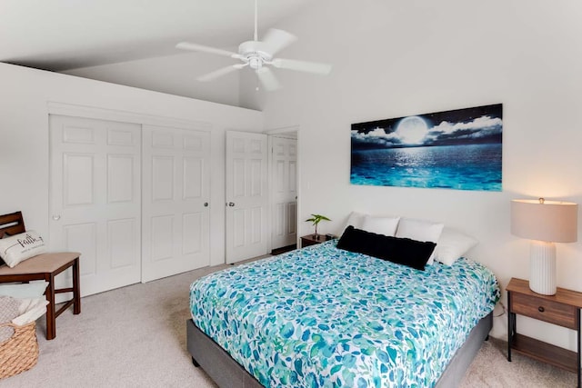 carpeted bedroom with ceiling fan and lofted ceiling