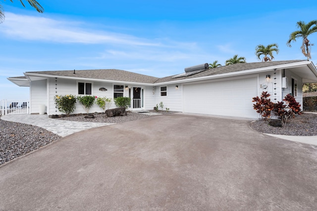 ranch-style home featuring a garage