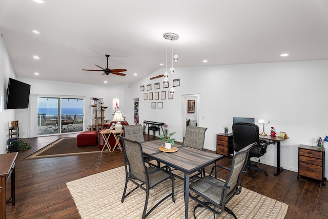 dining area featuring dark hardwood / wood-style floors, vaulted ceiling, and ceiling fan