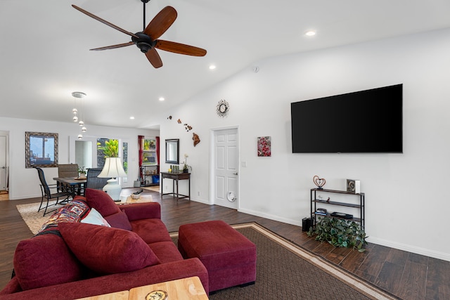 living room featuring ceiling fan, dark hardwood / wood-style flooring, and vaulted ceiling