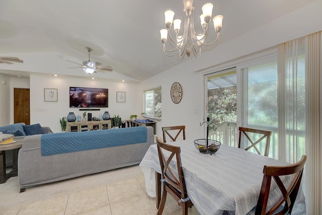 dining room featuring light tile patterned floors, ceiling fan with notable chandelier, and lofted ceiling