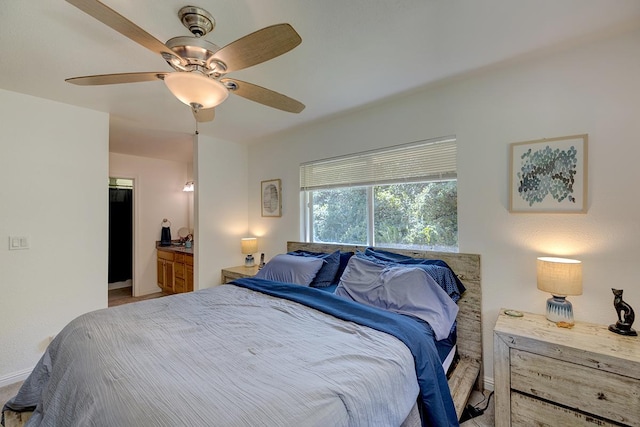 bedroom with ceiling fan and ensuite bathroom