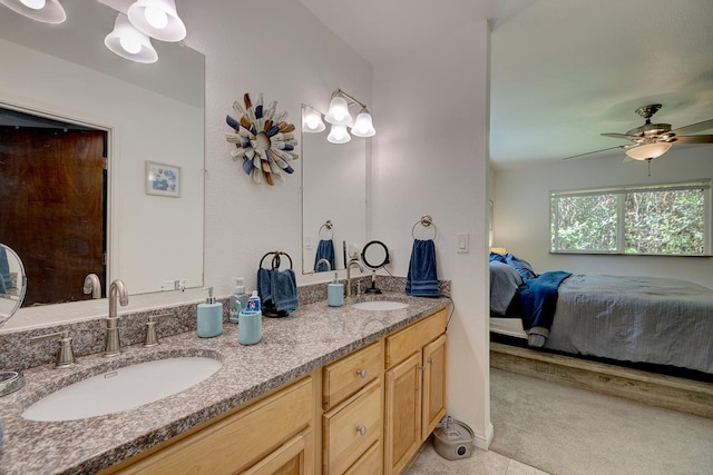 bathroom featuring tile patterned floors, ceiling fan, and vanity