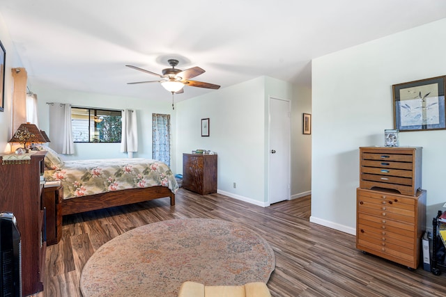 bedroom featuring a closet, ceiling fan, and dark wood-type flooring