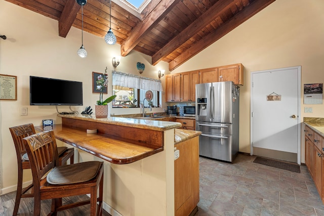 kitchen with stainless steel appliances, a kitchen breakfast bar, beamed ceiling, kitchen peninsula, and decorative light fixtures