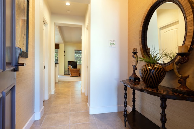 hall featuring light tile patterned floors