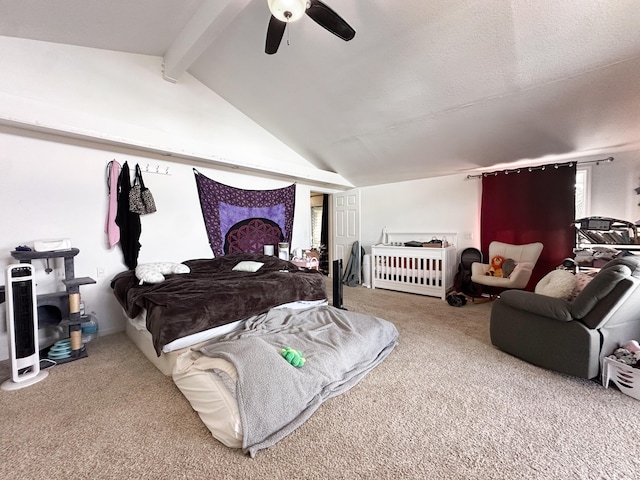 carpeted bedroom featuring ceiling fan, vaulted ceiling with beams, and a textured ceiling