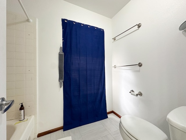 bathroom featuring toilet, tile patterned flooring, and shower / bath combination with curtain