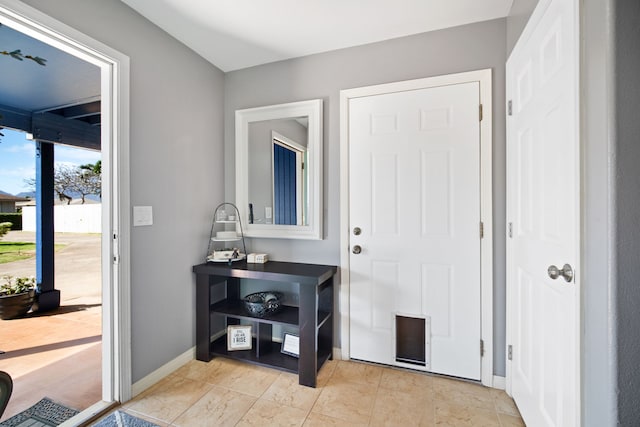 foyer with light tile patterned floors