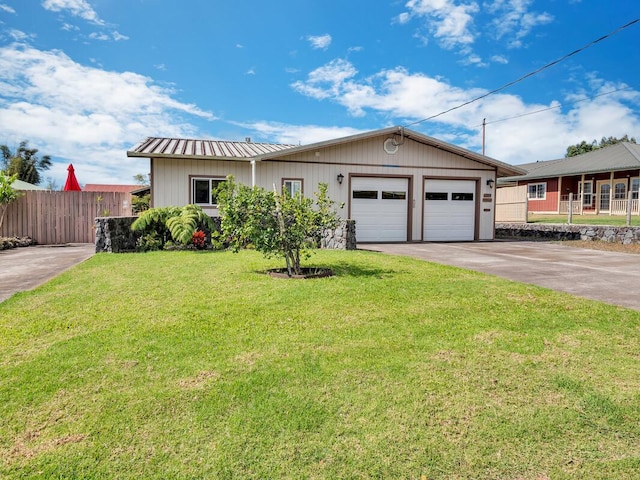 single story home featuring a garage and a front lawn