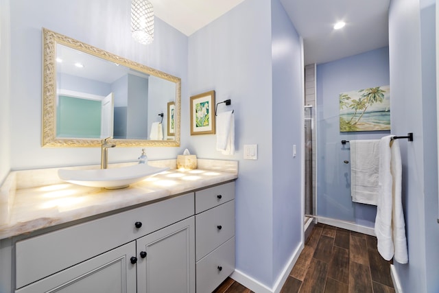 bathroom with vanity and walk in shower