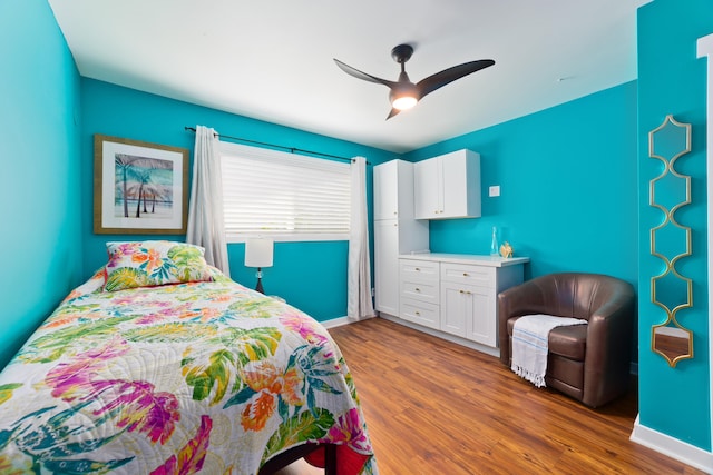 bedroom with ceiling fan and hardwood / wood-style floors