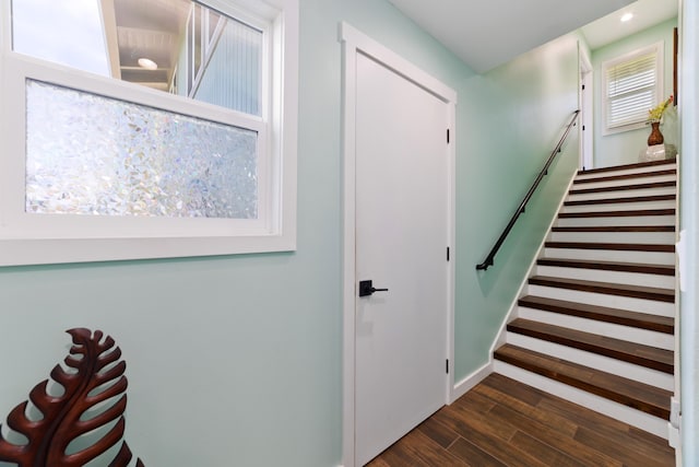 stairs with hardwood / wood-style floors