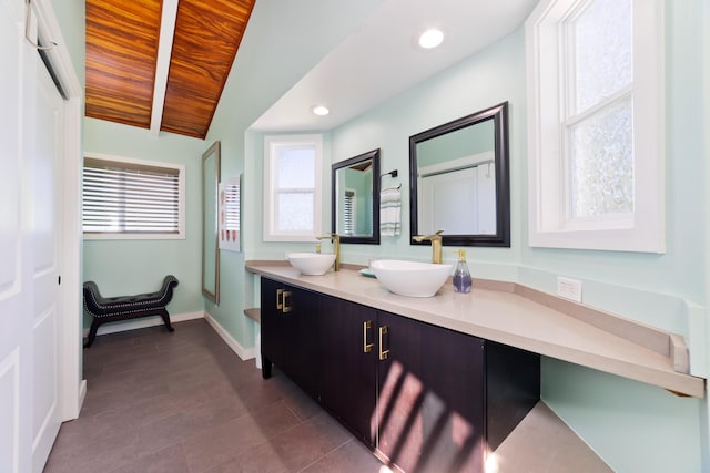 bathroom with wood ceiling, vanity, and vaulted ceiling