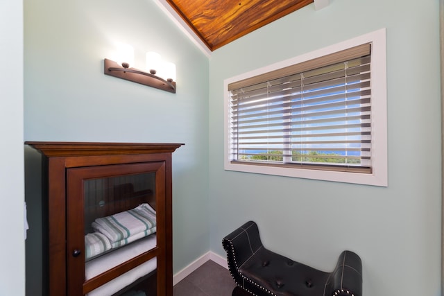 sitting room with lofted ceiling and wooden ceiling