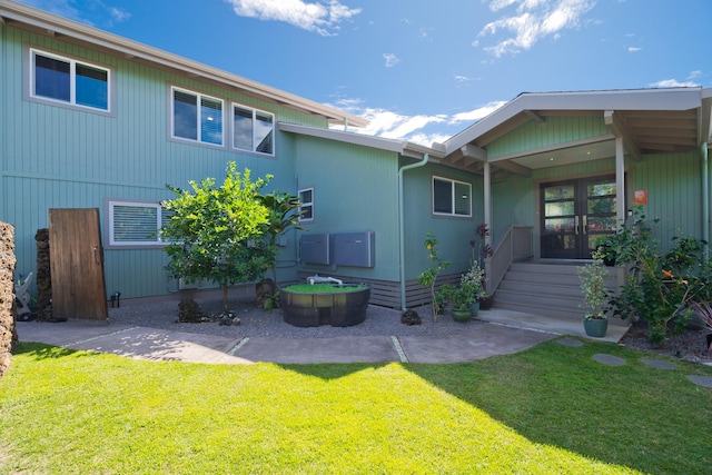 back of house featuring a yard