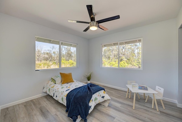 bedroom featuring ceiling fan and light hardwood / wood-style flooring