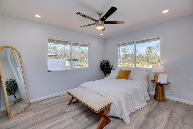 bedroom featuring light wood-type flooring and ceiling fan