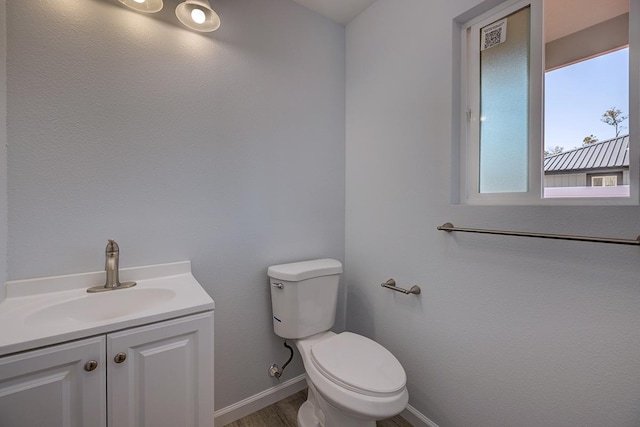 bathroom with vanity and toilet