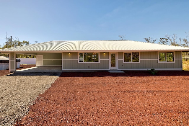 single story home featuring a carport