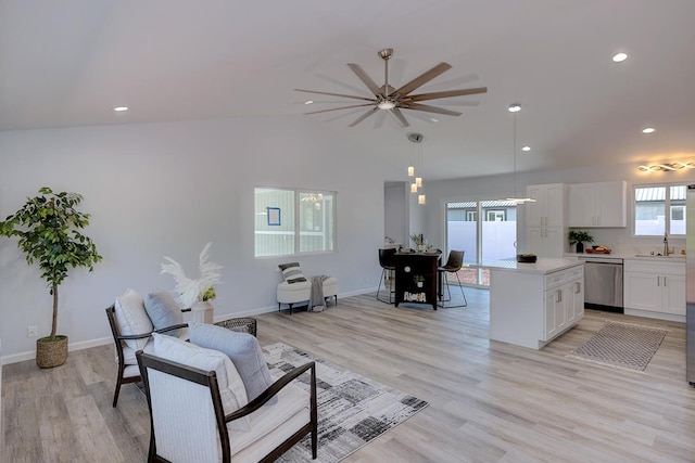 living room with light wood-type flooring and ceiling fan