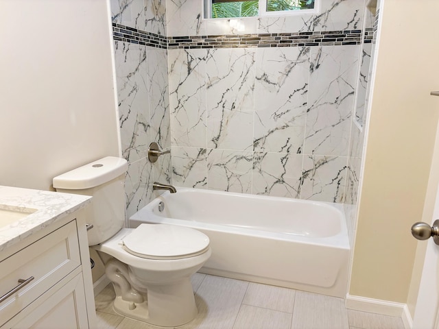 full bathroom featuring tile patterned flooring, vanity, toilet, and tiled shower / bath combo