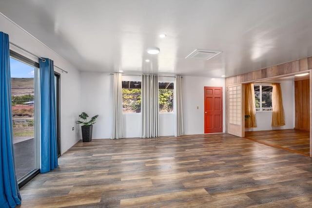 empty room with dark wood-type flooring