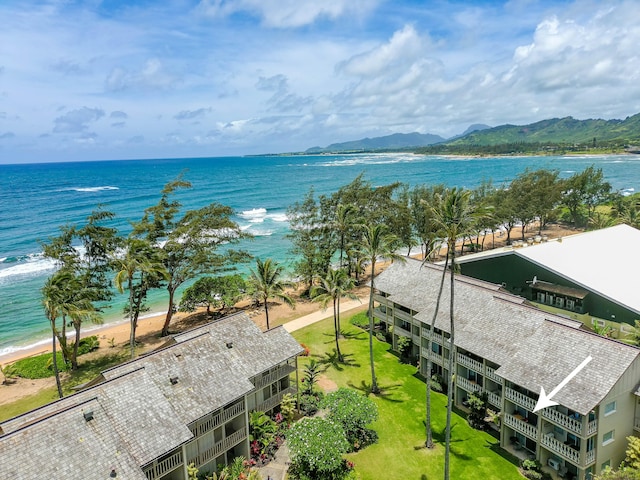 birds eye view of property with a beach view and a water view