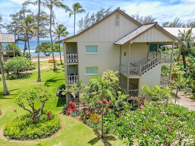 exterior space featuring a yard and a water view