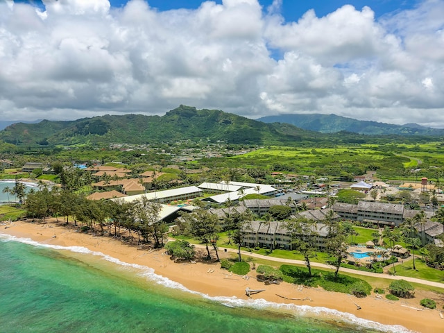 bird's eye view with a water and mountain view and a view of the beach