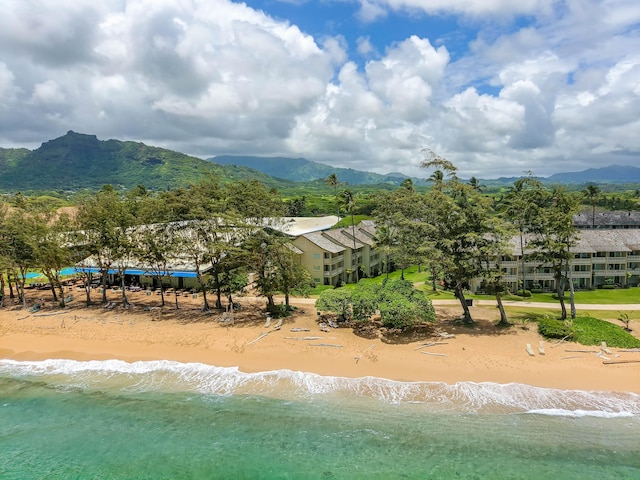 exterior space featuring a water view and a view of the beach