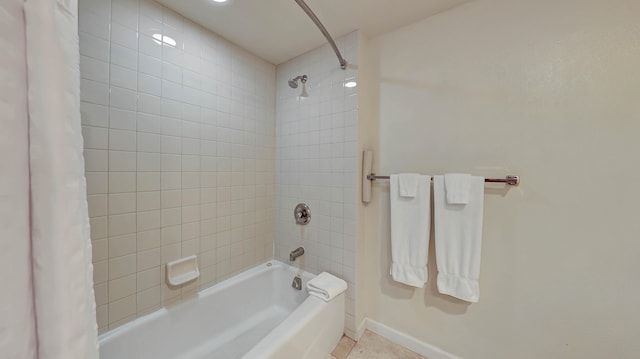 bathroom featuring tile patterned flooring and shower / bath combo with shower curtain