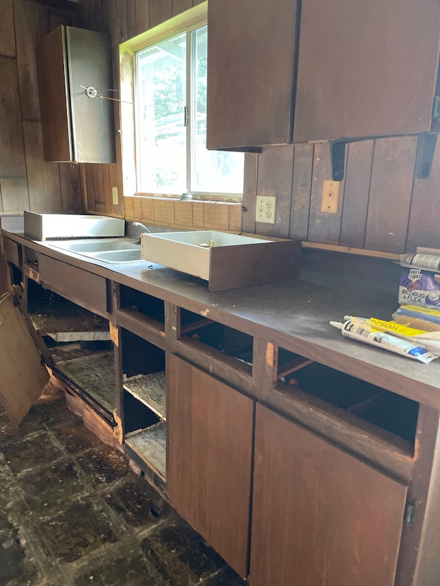 kitchen featuring wooden walls