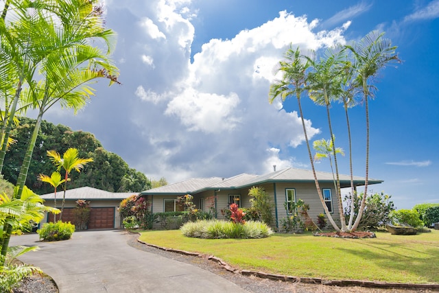 single story home featuring a front yard and a garage