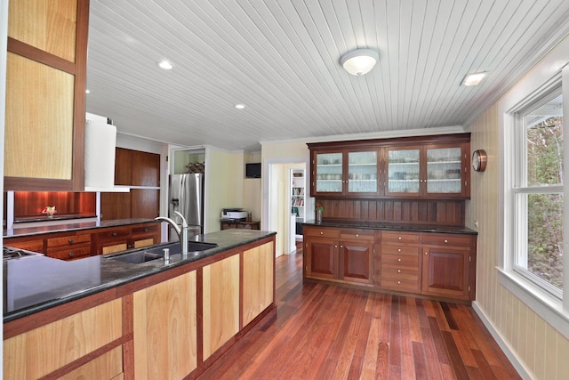 kitchen featuring sink, stainless steel fridge with ice dispenser, dark hardwood / wood-style flooring, wood ceiling, and ornamental molding