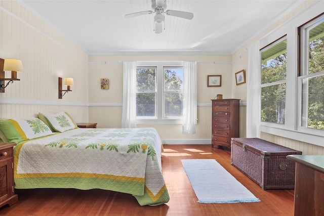 bedroom with light wood-type flooring and ceiling fan