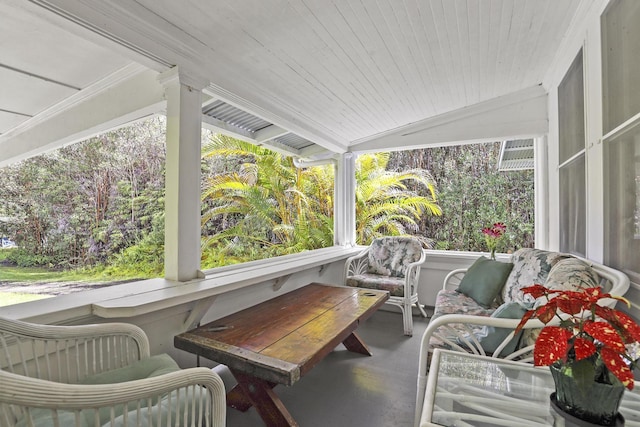 sunroom / solarium featuring lofted ceiling and wood ceiling