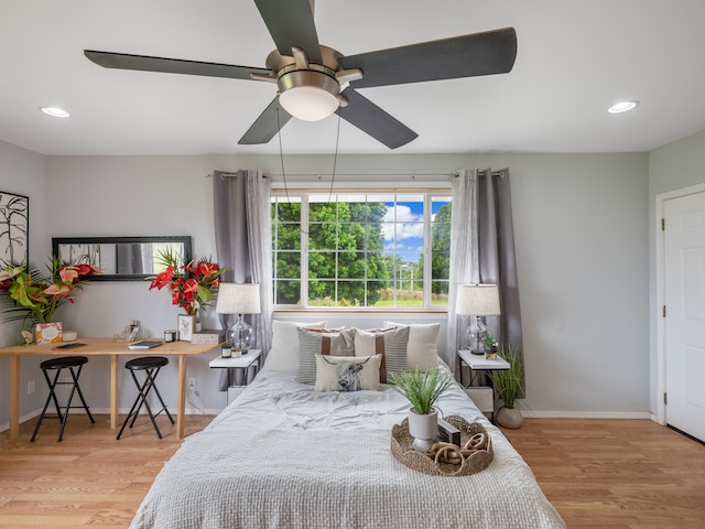 bedroom featuring light hardwood / wood-style floors and ceiling fan