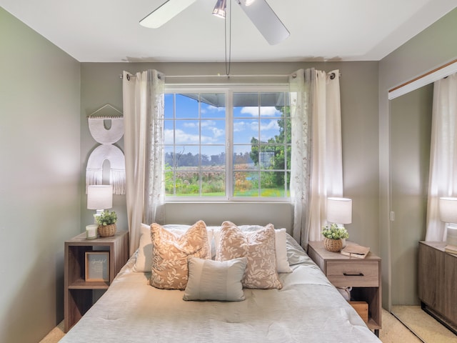 carpeted bedroom featuring ceiling fan