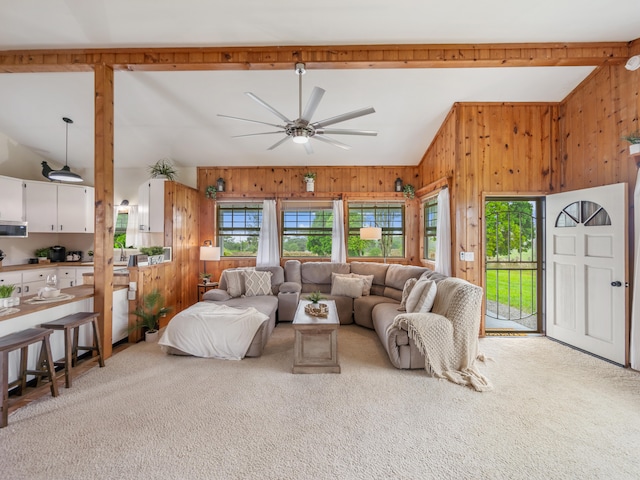 living room with carpet flooring, ceiling fan, and lofted ceiling with beams