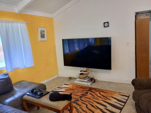 living room featuring lofted ceiling with beams, wood ceiling, and light tile patterned flooring