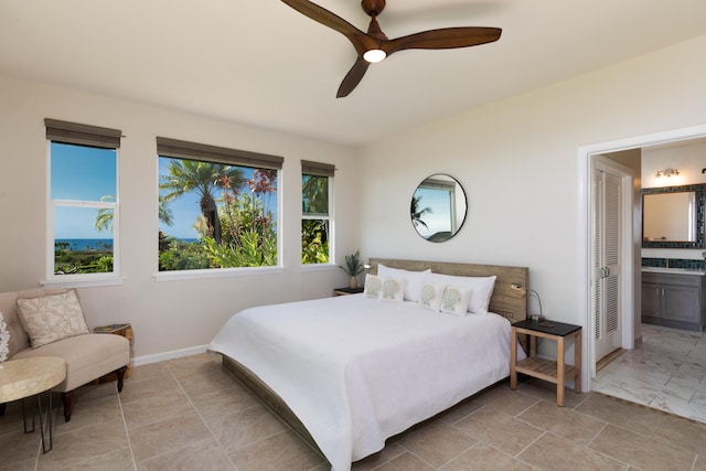 bedroom featuring ensuite bathroom and ceiling fan