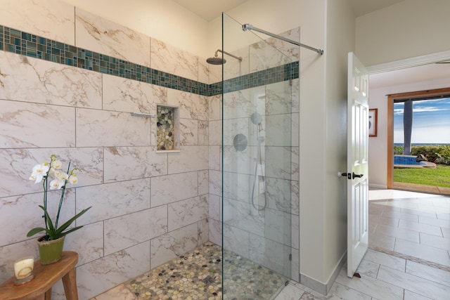 bathroom with tiled shower