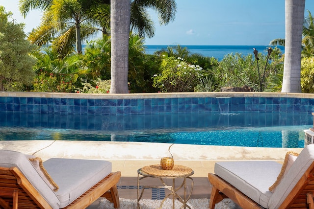 view of pool with a water view