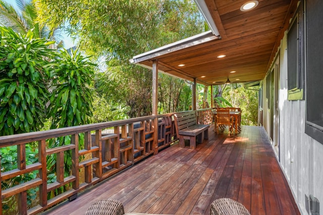 wooden deck featuring ceiling fan