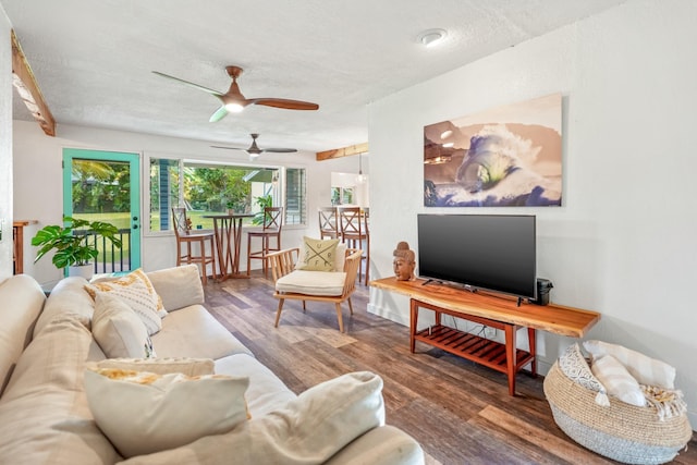 living room with hardwood / wood-style floors, a textured ceiling, and ceiling fan