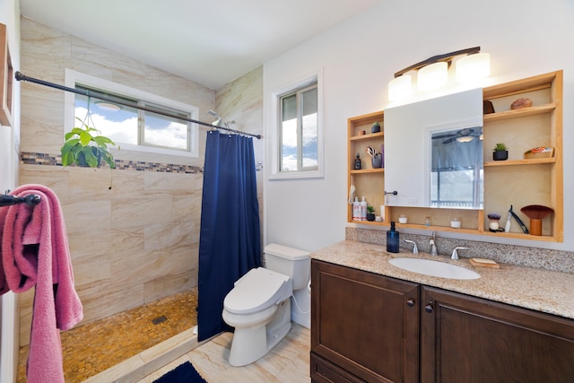 bathroom featuring walk in shower, vanity, toilet, and a wealth of natural light