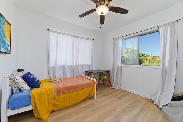 bedroom featuring light hardwood / wood-style floors and ceiling fan