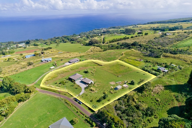 aerial view with a rural view and a water view