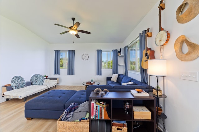 living room featuring ceiling fan and wood-type flooring